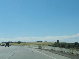 Wyoming 210 commences west after the Interstate 25 interchange, where Missile Drive changes into Happy Jack Road near the southern entrance to Francis E. Warren Air Force Base.