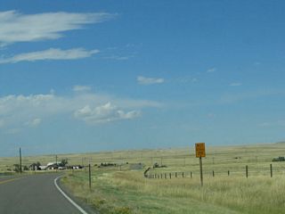 This reassurance shield is posted along westbound Happy Jack Road.