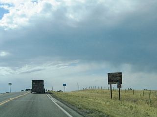 Westbound Wyoming 210/Happy Jack Road approaches Curt Gowdy State Park, which features reservoirs.