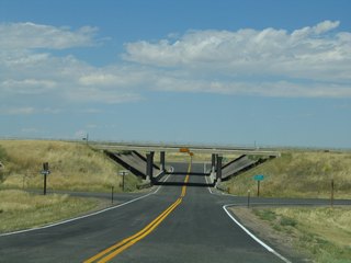 I-80 / U.S. 30 continue west from the end of WYO 225 to Laramie and east for a return to Cheyenne. The freeway bypasses short sections of old Lincoln Highway which are not passible or located on private property between WYO 225 and Vedauwoo Road (Exit 329) in Albany County.