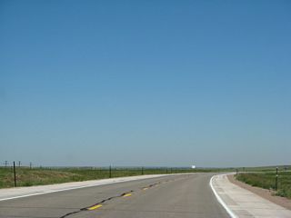 Civilization begins to appear as U.S. 287 proceeds north into the outskirts of Laramie. Ranches, solitary houses, and eventually industrial activity increases as U.S. 287 gets closer to the Gem City of the Plains.