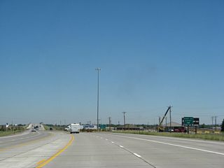 With four lanes and a center turn lane, U.S. 287 north meets the exit to the Port of Entry (weigh station).
