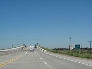 Northbound U.S. 287 approaches its junction with Interstate 80, one-half mile. Interstate 80 travels east to Cheyenne and northwest to Rawlins.