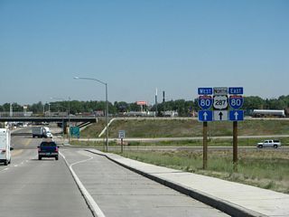 Now in Laramie, northbound U.S. 287 (Third Street) reaches its junction with Interstate 80. The first right connects to Albany County Route 20/Skyline Drive, and the second right connects to Interstate 80 east to Cheyenne. Use Skyline Drive east to motels and businesses on the south side of the freeway. A third right connects to a loop ramp that links to Interstate 80 west to Rawlins and Rock Springs.