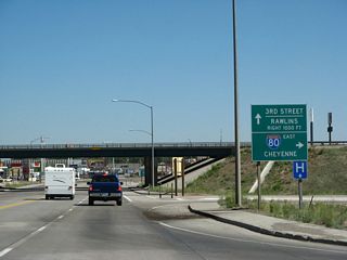 Northbound U.S. 287/Third Street meets the on-ramp to Interstate 80 east to Cheyenne. The following right turn will connect to a loop ramp that links to Interstate 80 west to Rawlins and Rock Springs.