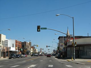 Laramie was founded in 1868 along the Union Pacific Railroad (UP) with its original business district centered along 1st Street and 2nd Street. E Garfield Street ends two blocks west of U.S. 287 at the pedestrian footbridge over the UP rail yard. The footbridge was erected in 1930.