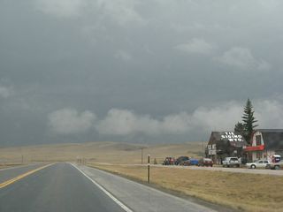 Southbound U.S. 287 approaches Tie Siding, a very small community with some services on the west side of the highway.