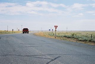 WY-295 south begins where CR 1NG overtakes the access road to the Elk Basin Gas Plant near Elk Basin.