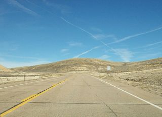 A passing lane comes into view as Wyoming 530 gets closer to the city of Green River. Incorporated in 1868 as part of Dakota Territory and again in 1891 as part of the new state of Wyoming, Green River is home to 11,808 people as of the 2000 Census and is the seat of Sweetwater County. The city is a hub for the trona mining industry; the trona mines are located west of Green River. In addition, the railroad, tourism to the Flaming Gorge, and Interstate traffic augment the economy of this vibrant region. There are no coal mines near Green River; those are primary located near Rock Springs (that city is located 15 miles east of Green River via Interstate 80 and U.S. 30). Green River is also the seat of Sweetwater County, so its courthouse is located downtown. The annual Flaming Gorge Days are a festival of fun during June.