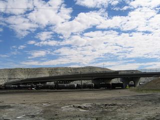 This vantage point shows the Wyoming 530/Uinta Drive viaduct crossing over the Union Pacific Railroad tracks as seen from a Maverik gas station located on East Second South Street.