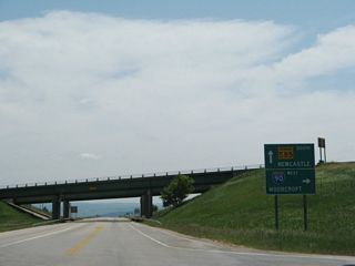 Wyoming 585 (Sixth Street) south at the entrance ramp for Interstate 90 west to Moorcroft, Gillette, Sheridan, Billings, and ultimately Seattle, Washington. I-90 is also part of the most direct route west to Yellowstone National Park either via U.S. 14 or U.S. 16.