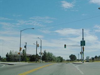 Once south of the viaduct, Ames Avenue meets Deming Drive. Follow Deming Drive southeast to the residential neighborhoods served by Ninth Street, Fifth Street, and First Street.