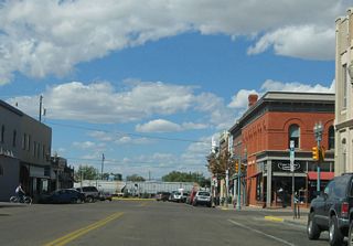 The rail yards of the Union Pacific Railroad are visible as westbound Grand Avenue approaches Second Street in downtown Laramie.