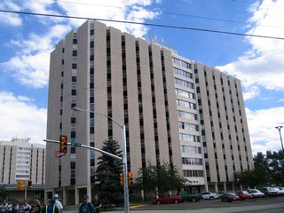 White Hall, McIntyre Hall, Orr Hall, and Hill Hall (dormitories) are all visible from eastbound Ivinson Avenue at the intersection with 15th Street.