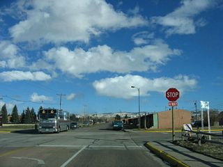 Near War Memorial Stadium, eastbound Willet Drive approaches 22nd Street. Follow 22nd Street south to the main War Memorial Stadium parking lot and to Grand Avenue (Business Loop I-80 and U.S. 30).