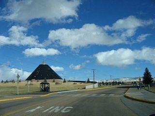 The teepee shaped American Heritage Center comes into view after Willet Drive curves around the Arena Auditorium. Inside the American Heritage Center are documents related to Wyoming's history as well as various journalist, historical, and political archives.