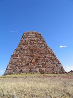 These photos show three of the four sides of the pyramid, which rises 60 feet above the high plains. Constructed in 1882, the monument was named for U.S. Congressman Oakes Ames and his brother Oliver Ames, who was the third president of the Union Pacific Railroad. According toGreetings from the Lincoln Highwayby Brian Butko (2005, pg. 187-8), this monument was intended as a monument for passing trains, but the railroad was realigned away from it in 1901. The Lincoln Highway originally passed by the monument, but it was rerouted away from it in 1920s and 1930s; today's version of the Lincoln Highway (Interstate 80) stays a couple miles north of here. As a result, the pyramid sits alone surrounded by sagebrush and dirt roads.
