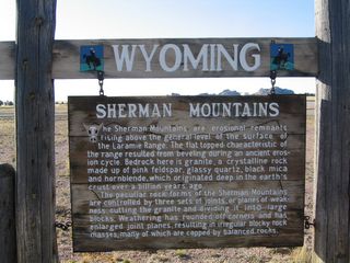 Near the Tree Rock is another sign welcoming travelers to the Sherman Mountains, which includes Sherman Hill and the Interstate 80 Summit. These mountains feature the irregular rocks and boulders such as those found at Vedauwoo, and the sign attempts to explain the the geological forces that have cut the bedrock granite. Over time, the granite was divided into large blocks that in turn were weathered through wind and precipitation through the ages. As a result, rocks such as those found at Vedauwoo and Pole Mountain are abundant in the Sherman Hill area.
