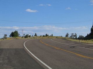 A wide spot in the road, with a turnout on the north side of the Old Lincoln Highway, offers a view of the surrounding area, including Pole Mountain to the north and Vedauwoo to the northeast. This turnout also marks the highest point on the transcontinental Lincoln Highway.
