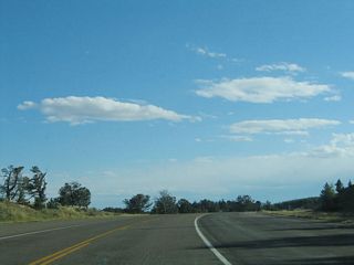 Finally reaching the top of Sherman Hill, the Lincoln Highway briefly flattens out. A spectacular view of Vedauwoo and Pole Mountain is available to the north of the old road.