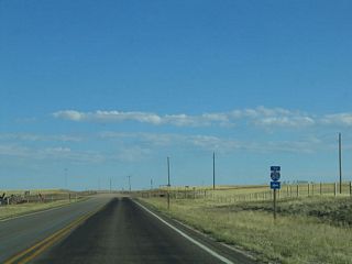 Eastbound Old U.S. 30/Lincoln Highway reaches the junction with Vedauwoo Road. The old highway still exists in sporadic segments between here and Otto Road (Wyoming 225), but significant portions were overlaid by Interstate 80 or are no longer in use. Turn right onto the gravel road to follow the 1913 alignment of the Lincoln Highway toward Ames Monument.