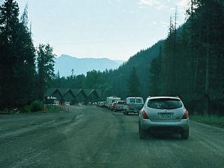 The east entrance station appears as East Entrance Road leaves Yellowstone National Park and transitions onto U.S. 14-16-20 east into Shoshone National Forest.